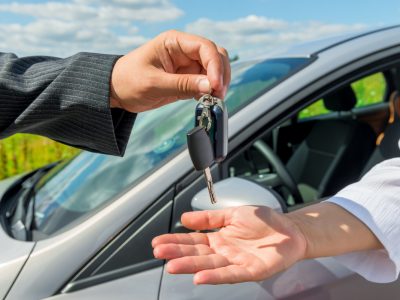 parking solemn transfer the key the buyer of a new car
